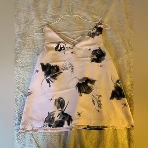 Light mauve-pink sleevelesss blouse with floral design